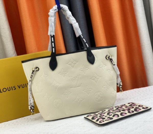 Replica Louis Vuitton Monogram Empreinte Wild At Heart Neverfull MM Tote In Cream