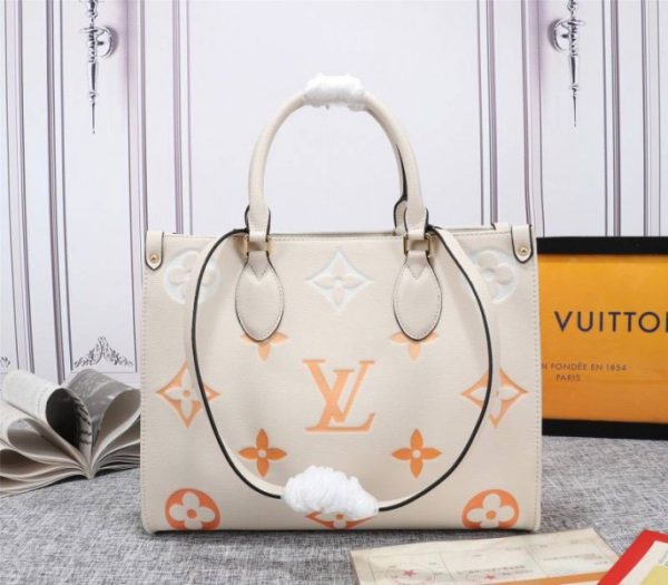 Replica Louis Vuitton Monogram Empreinte Leather Onthego MM Bag In Cream Saffron