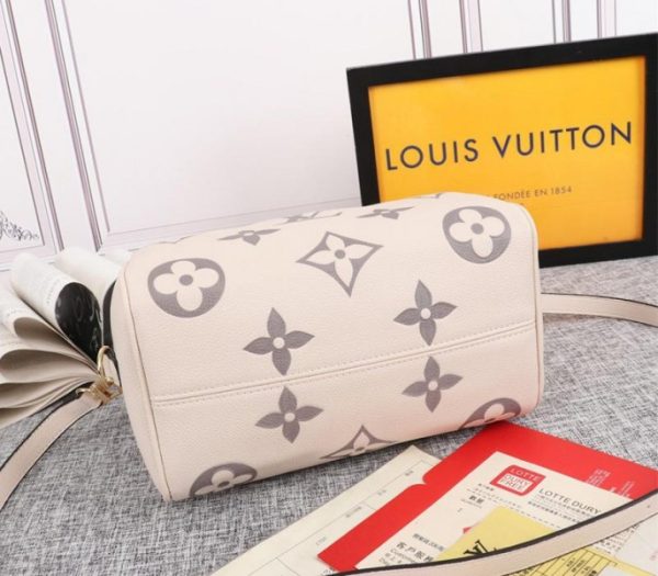 Replica Louis Vuitton Bicolor Monogram Empreinte Leather Speedy Bandouliere 25 Handbag In Cream And Bois De Rose Pink - Image 4