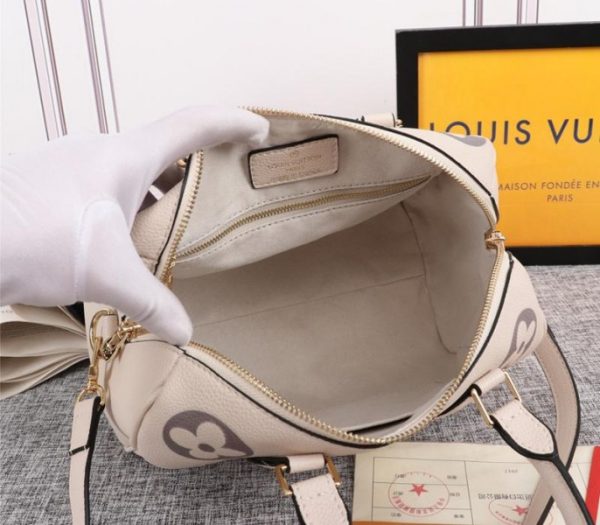 Replica Louis Vuitton Bicolor Monogram Empreinte Leather Speedy Bandouliere 25 Handbag In Cream And Bois De Rose Pink - Image 5