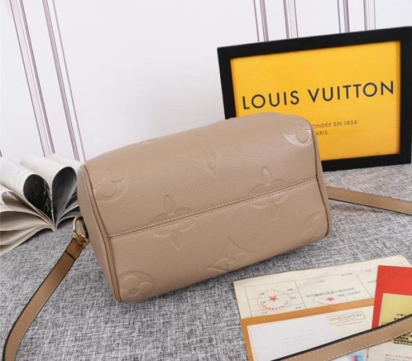 Replica Louis Vuitton Monogram Empreinte Leather Speedy Bandouliere 25 Handbag In Tourterelle Gray - Image 4