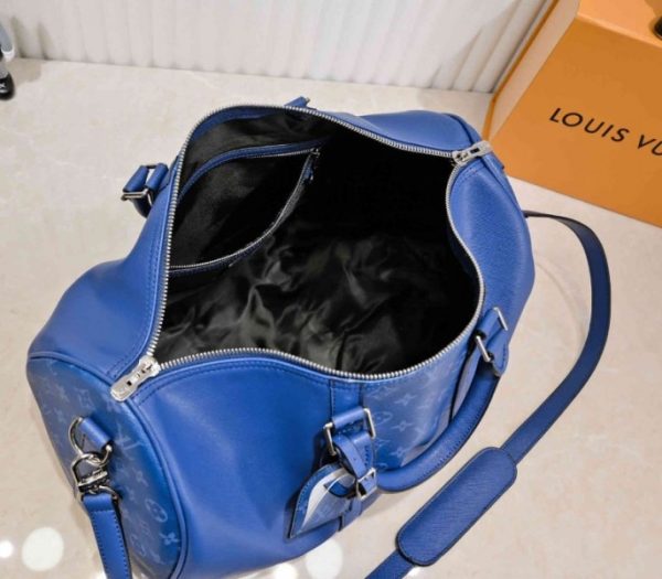 Replica Louis Vuitton Taiga Leather Keepall Bandouliere 50 Travel Bag In Navy Blue - Image 5