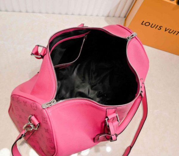 Replica Louis Vuitton Taiga Leather Keepall Bandouliere 50 Travel Bag In Pink - Image 5