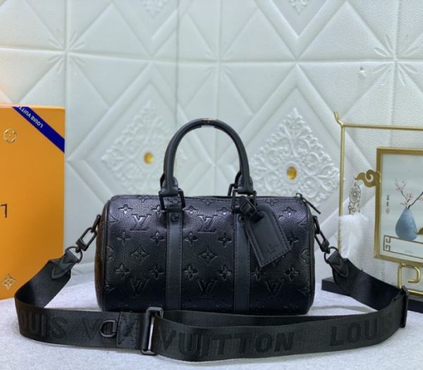 Replica Louis Vuitton Taurillon Monogram Leather Keepall Bandouliere 25 In Black